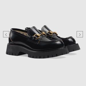 Chunky black and gold Gucci Loafers